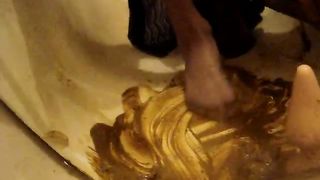 Rubbing the scat all over my bathtub and feet
