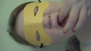 Masked chick eating her own poop