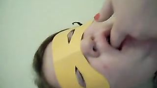 Masked chick eating her own poop
