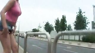 Flashing girl pissing in public