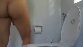 Amateur chick pooping in the toilet