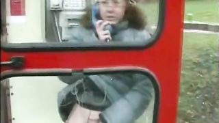 Public pissing in phone booth