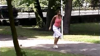 Sexy chick lifting her skirt to piss
