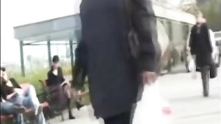 Public pissing girl showing her tits and taking a pee