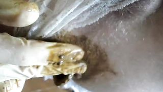 Rubbing the asshole with poop on it