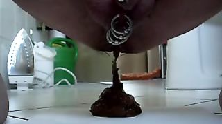 guy with piercings in his cock taking a shit