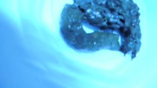 Playing with her poop