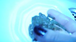 Playing with her poop