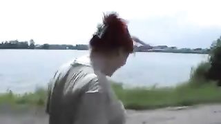 Redhead peeing outdoor