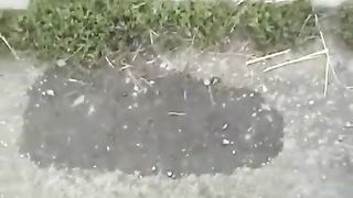 Redhead peeing outdoor