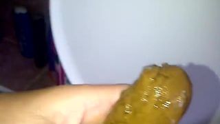 Sucking a yellow turd
