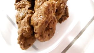 Creamy poop in a white plastic box