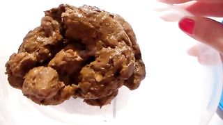 Creamy poop in a white plastic box