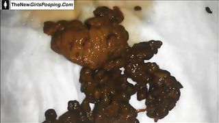 Black babe pooping on a white napkin