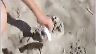 Shitting on the sand for her boyfriend