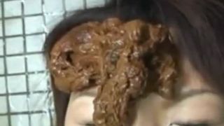 Smearing creamy shit on her face