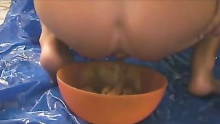 Shitting in an orange bowl