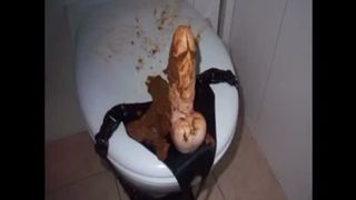 Riding a big dildo in the bathroom