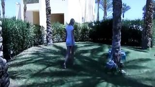 Blonde MILF shitting on the grass