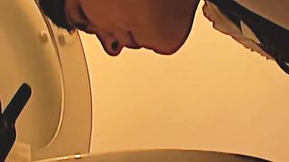 Overeating Girl Puking in the Toilet