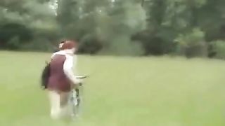 School girl pooping on a field