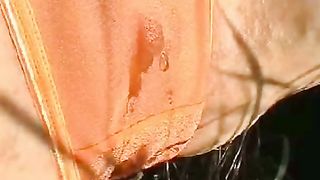 Peeing in her orange panties