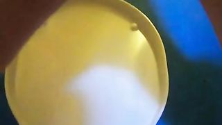 Young blonde pooping over the toilet