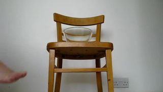 Hairy girl pooping a very long turd