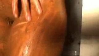 Rubbing shit on her entire body