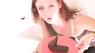 Hard brown turd on a red plate