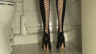 Wearing black high heels with scat