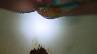 Shitting in her blue and white panties