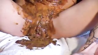 Rubbing shit on her entire body