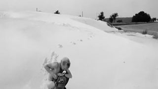 Black and white video of a girl shitting