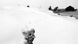 Black and white video of a girl shitting