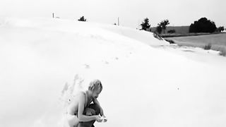 Black and white video of a girl shitting