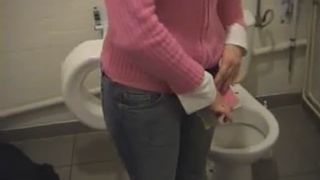 Teen girl pooping over the toilet