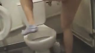 Teen girl pooping over the toilet