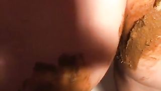 Teen girl smearing fresh poop on her entire body