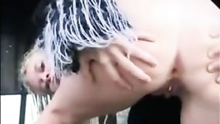 Blonde girl shitting in snow