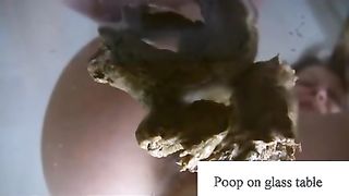 Pooping on a glass table