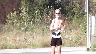 Busty blonde babe peeing in public