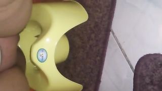 Chubby woman shitting in yellow potty