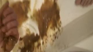 Smearing shit on her clean body