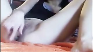 Young girl shitting olives on the bed