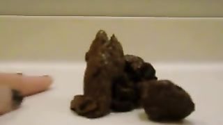 Shitting between her legs