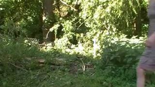 Tattooed blonde pooping in nature