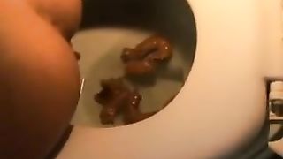 Four tiny pieces of poop in the toilet
