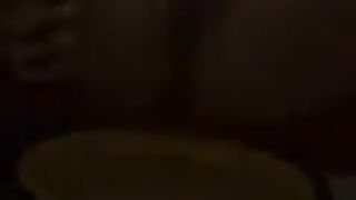 Brunette hottie shitting on a red couch