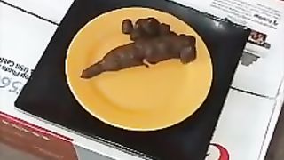 Brunette hottie shitting on a red couch